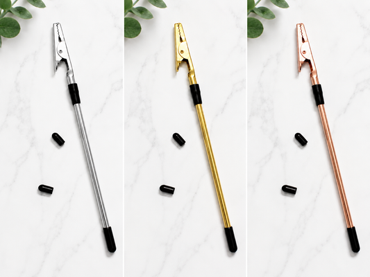 Three telescopic pole pruners in different colors on a white background with green leaves.