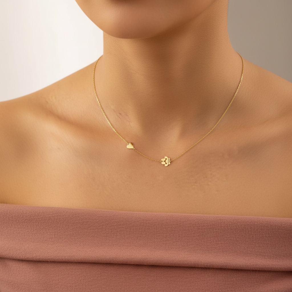 Asian model wearing personalized paw print heart necklace in gold